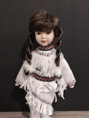 Porcelain Collectible Doll in White Fringe Outfit with Brown Braided Hair